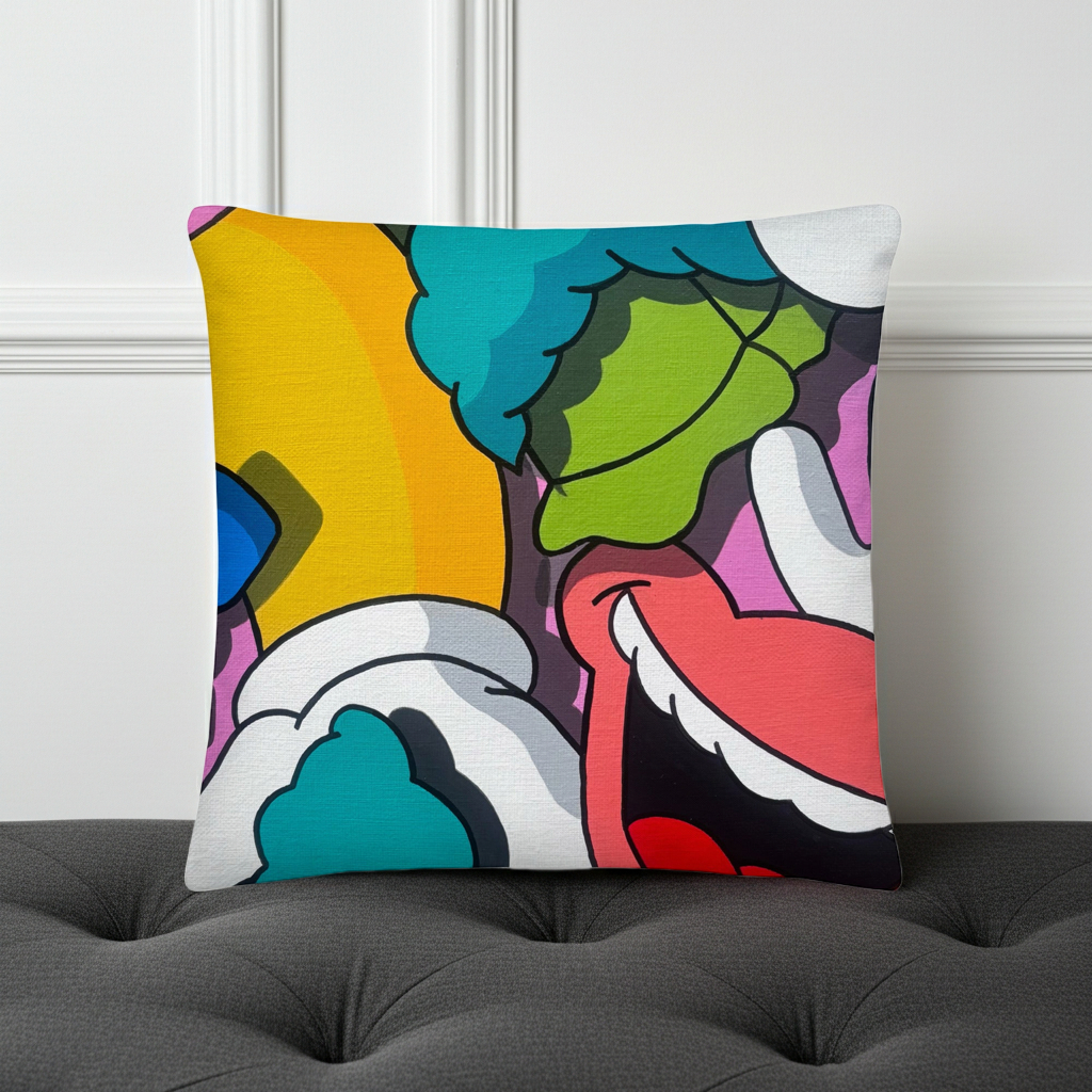 Colorful abstract pillow on a gray sofa against a white wall